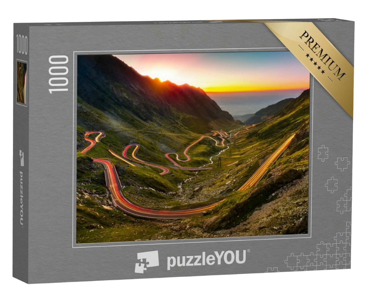 Puzzle 1000 Teile „Verkehrsspuren auf dem Transfagarasan-Pass bei Sonnenuntergang, Rumänien“