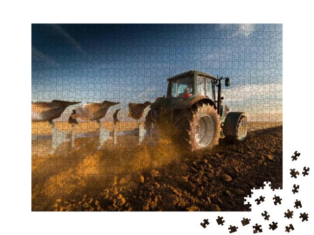 Puzzle 1000 Teile „Traktor beim Pflügen von Feldern“