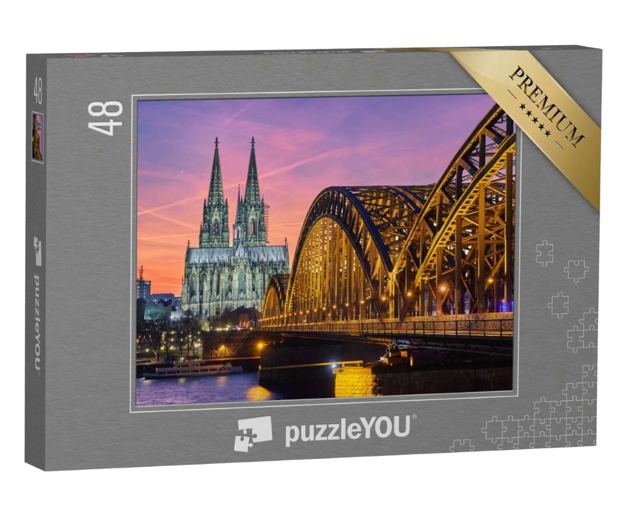 Puzzle 48 Teile „Kölner Dom und Hohenzollernbrücke bei Sonnenuntergang“