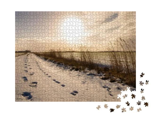Puzzle 1000 Teile „Fußspuren durch den Schnee, Ostfriesland“