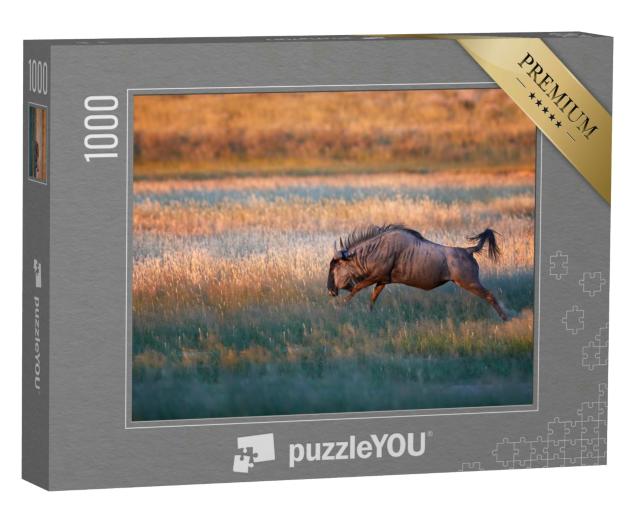 Puzzle 1000 Teile „Kalahari-Savanne: Streifengnu im Sprung“