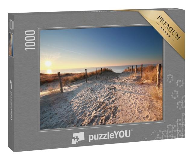 Puzzle 1000 Teile „Sonnenlicht über einem Sandweg zum Nordseestrand, Holland“