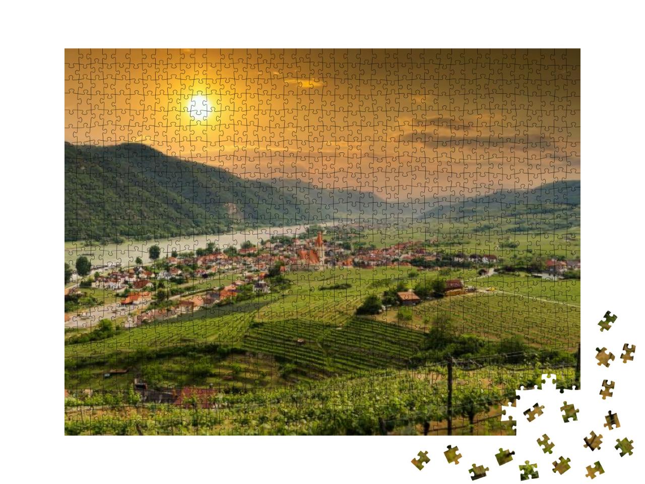 Puzzle 1000 Teile „Blick auf das Wachautal mit Donau und der Stadt Weißenkirchen“