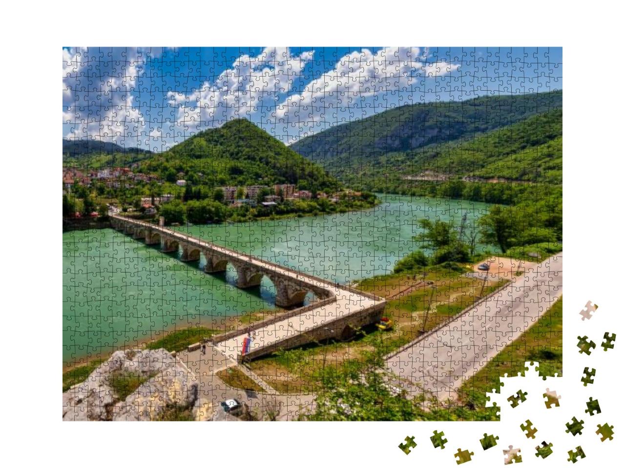 Puzzle 1000 Teile „Mehmed-Pascha-Sokolovic-Steinbrücke am Fluss Drina“