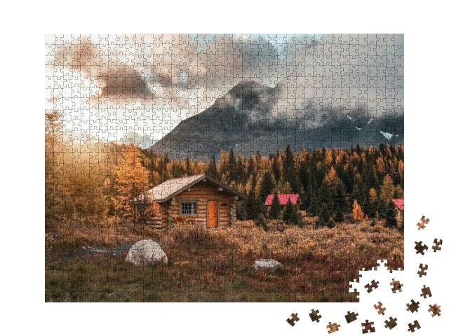 Puzzle 1000 Teile „Holzhütten bei Sonnenschein im Wald im Assiniboine Provincial Park, Kanada“
