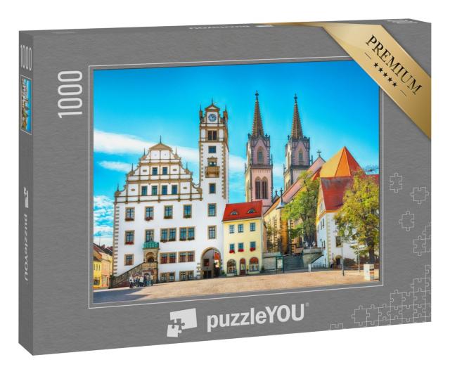 Puzzle 1000 Teile „Stadtbild des Oschatzer Hauptplatzes mit Stadtverwaltung und St. Aegidien, Sachsen“