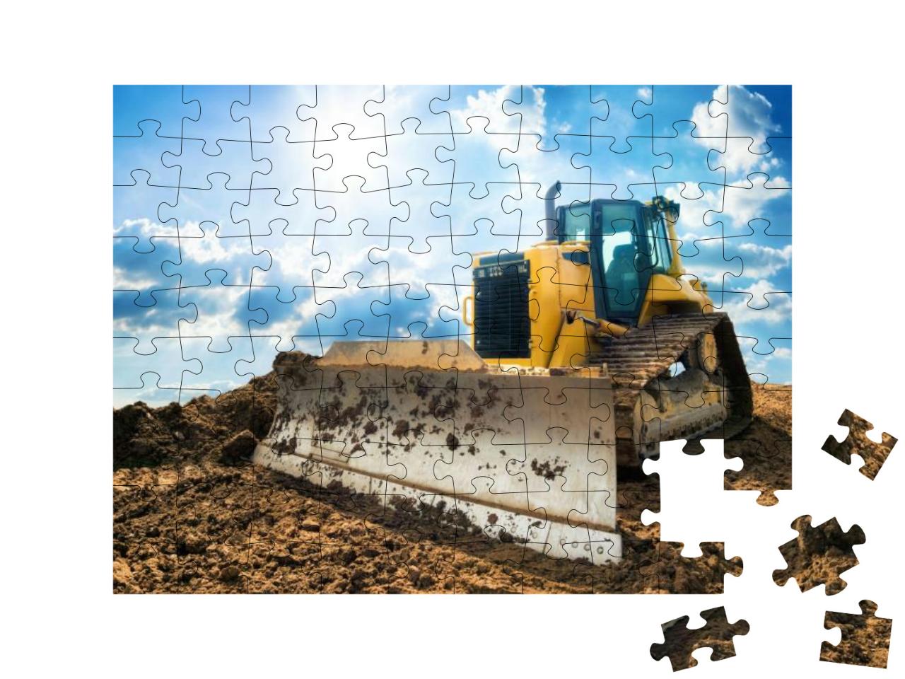 Puzzle 100 Teile „Gelber Bagger auf neuer Baustelle vor dem blauen Himmel“