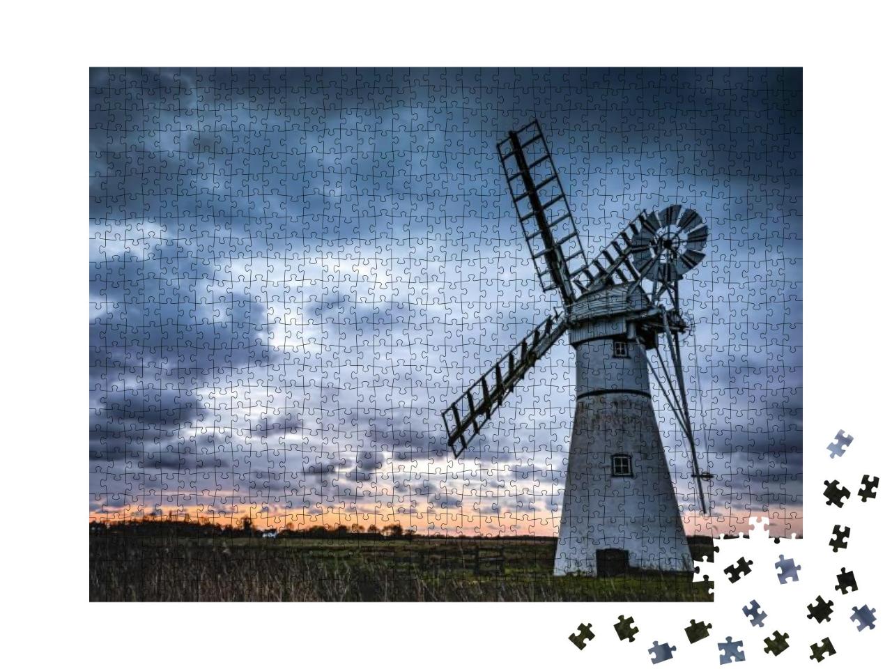 Puzzle 1000 Teile „Eine Mühle auf einem Feld vor dem Hintergrund des Sonnenuntergangs“