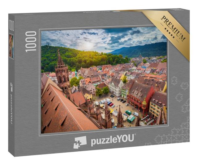 Puzzle 1000 Teile „Historisches Zentrum von Freiburg aus der Luft, Münster im Abendlicht“