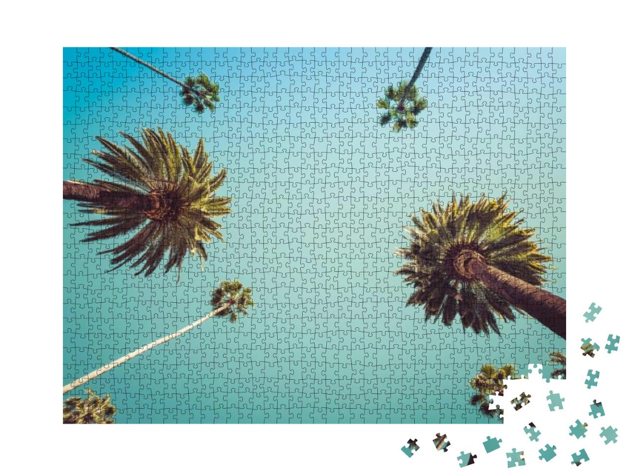 Puzzle 1000 Teile „Blick nach oben: Blauer Himmel über Palmen“