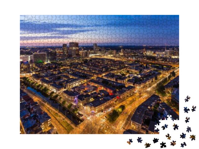 Puzzle 1000 Teile „Den Haag (Den Haag) Skyline von oben bei Dämmerung, Niederlande.“