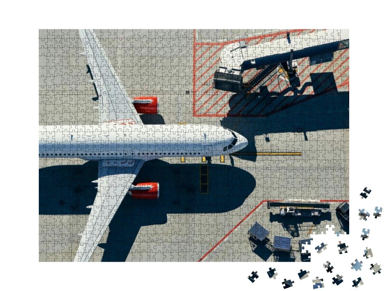 Puzzle 1000 Teile „Blick aus der Vogelperspektive: Flugzeug am Gate des Terminals“