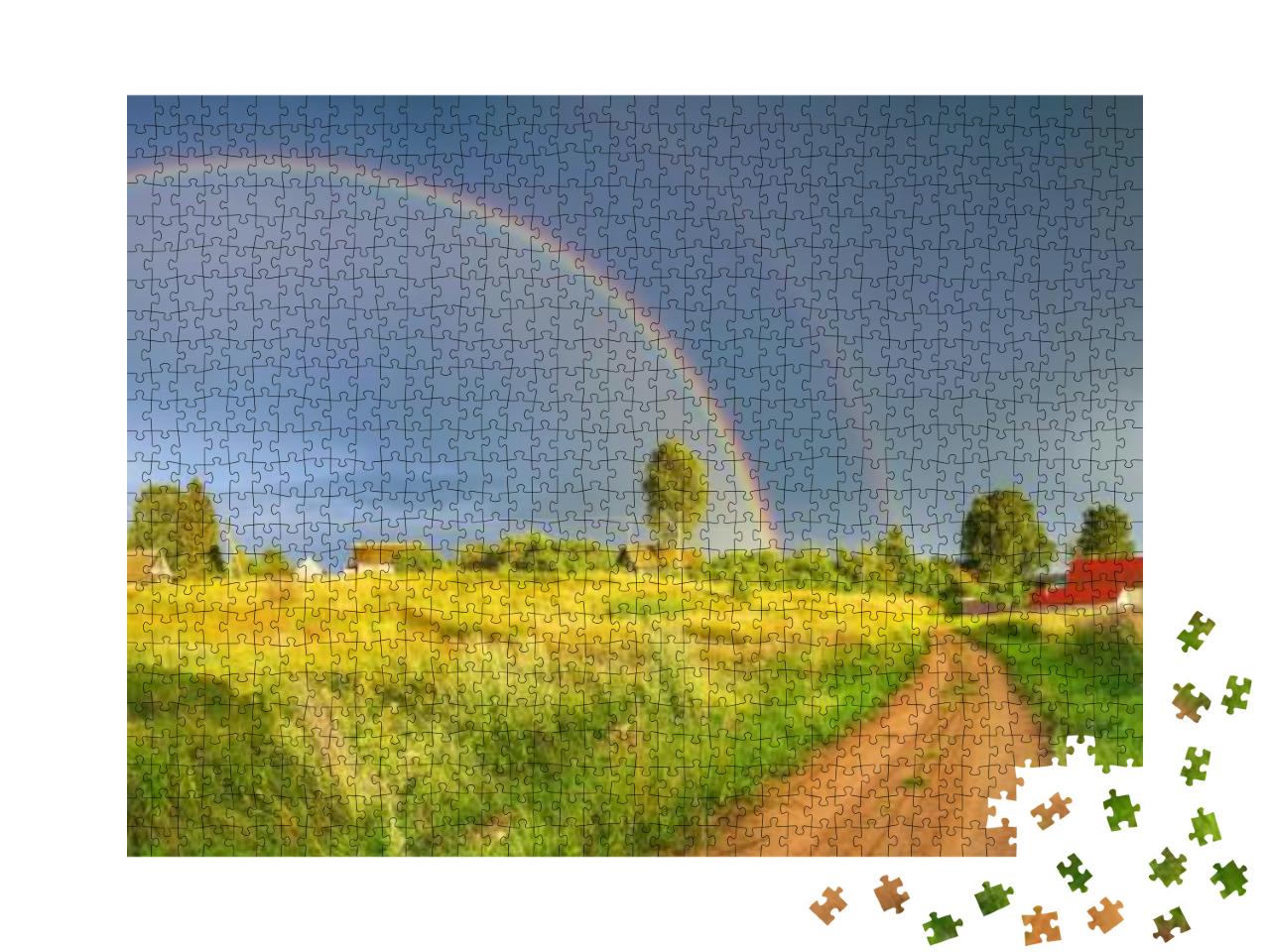 Puzzle 1000 Teile „Regenbogen über dunklen Regenwolken in ländlicher Landschaft“