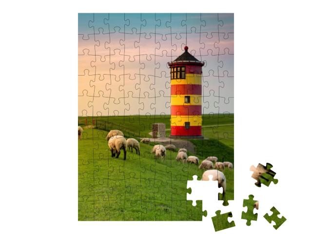 Puzzle 100 Teile „Ein schöner Leuchtturm an der ostfriesischen Küste“