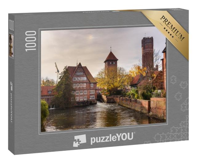 Puzzle 1000 Teile „Ratsmühle oder alte Wassermühle und Wasserturm an der Ilmenau, Lüneburg“