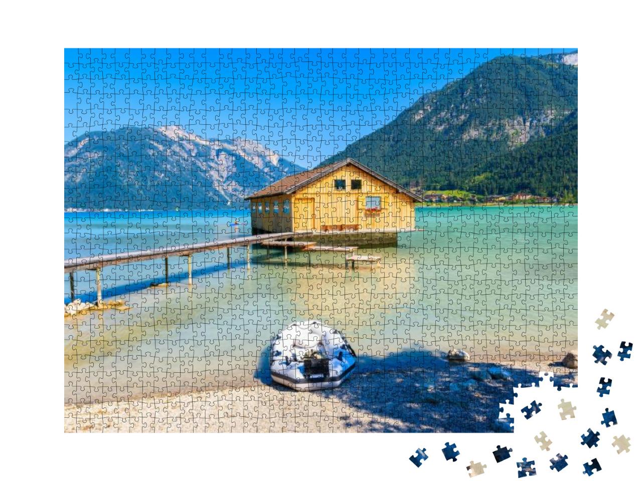 Puzzle 1000 Teile „Bootshaus am Ufer des Achensees, Österreich“