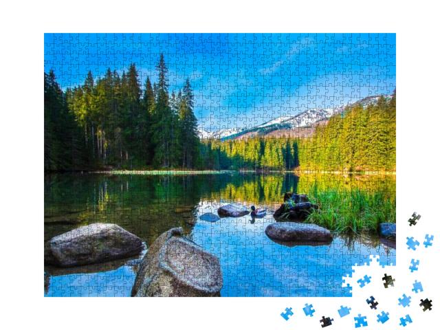 Puzzle 1000 Teile „Steine im ruhigen Wasser eines Bergsees“