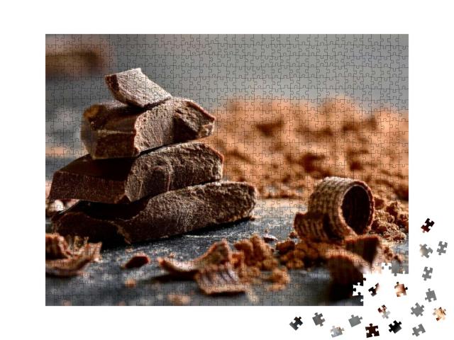 Puzzle 1000 Teile „Dunkle Schokolade in Stücken, umgeben von Kakaopulver“