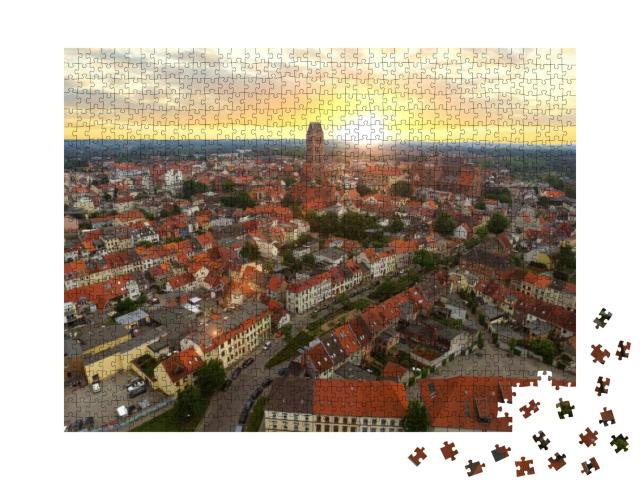 Puzzle 1000 Teile „Historische Hansestadt Wismar im Sonnenuntergang“