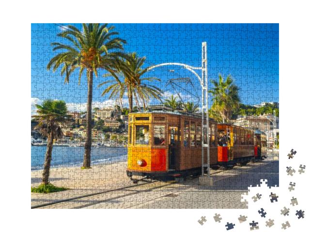 Puzzle 1000 Teile „Berühmte orangene Straßenbahn fährt von Soller nach Port de Soller, Mallorca, Spanien“
