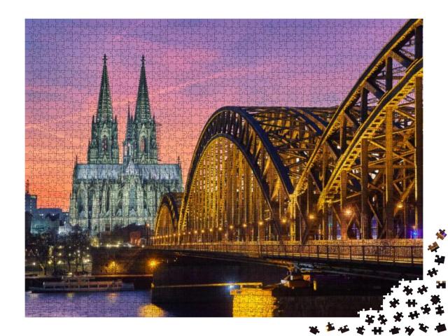 Puzzle 2000 Teile „Kölner Dom und Hohenzollernbrücke bei Sonnenuntergang“